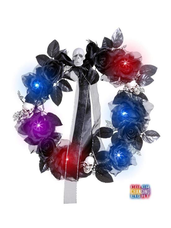 Corona de calaveras y rosas negras con luz cambiante